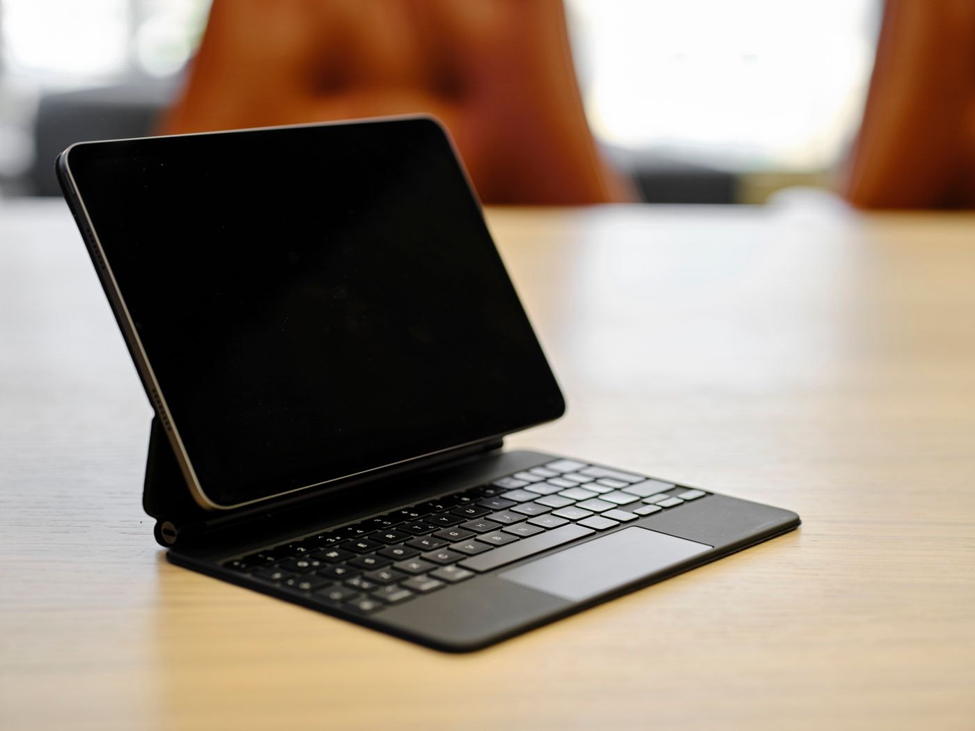 Tablet supported by its keyboard case on a table