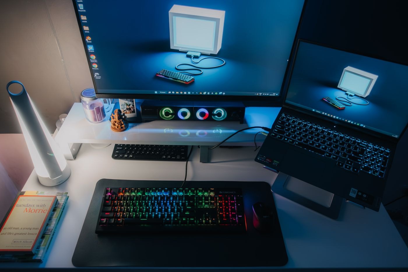 Laptop and desktop display sharing a work surface