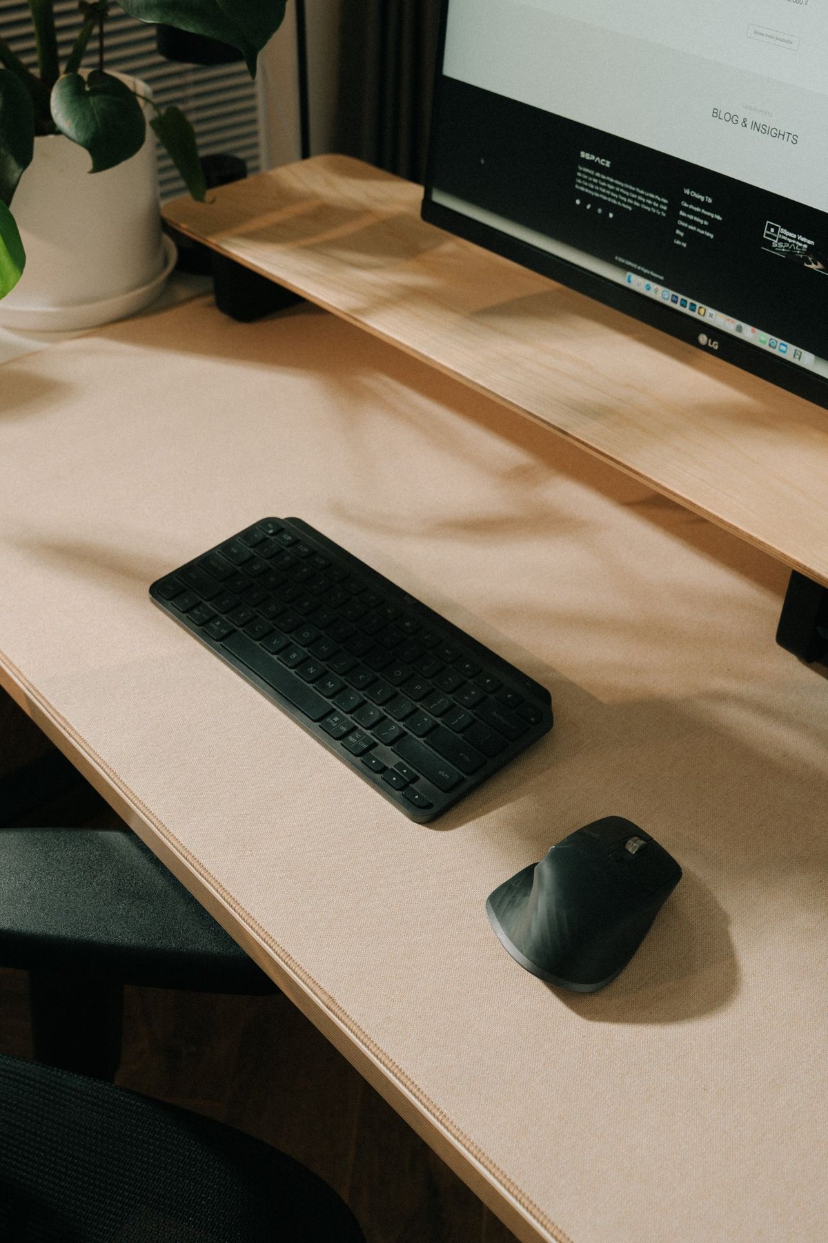 Monitor with a compact keyboard and mouse below it