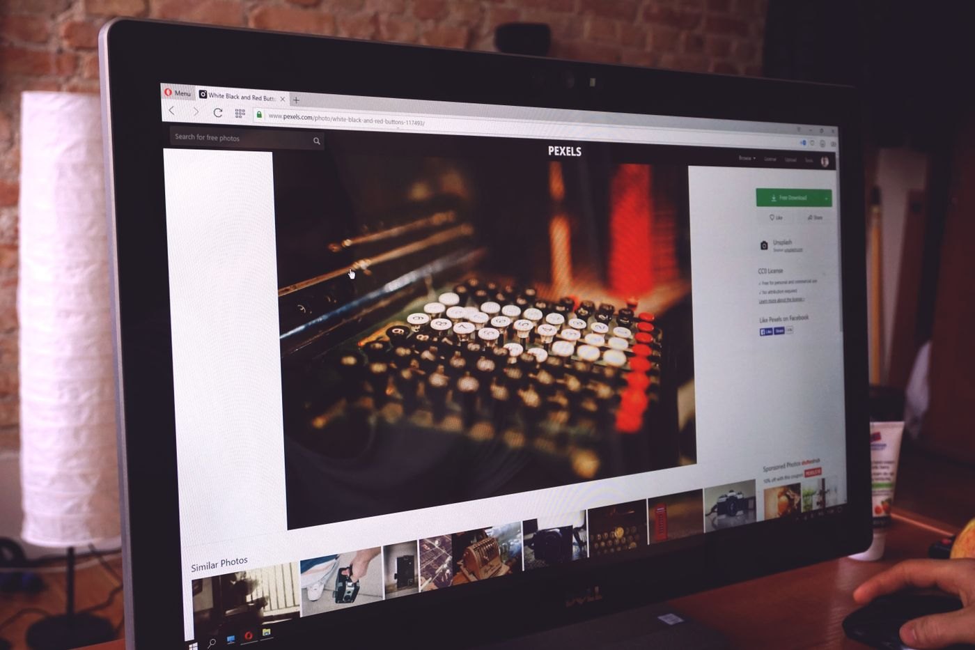 Monitor displaying a photograph on a desk