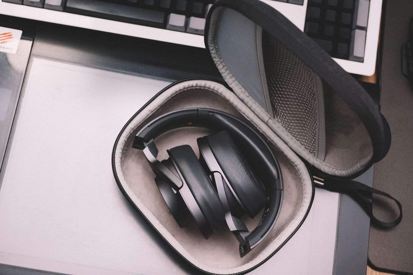 Folded headphones inside an open zippered case