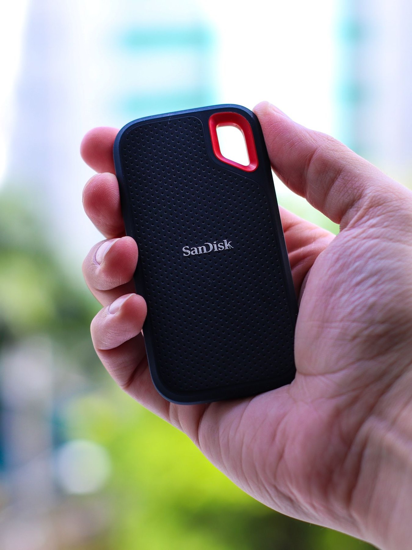 Hand holding a compact portable solid-state drive