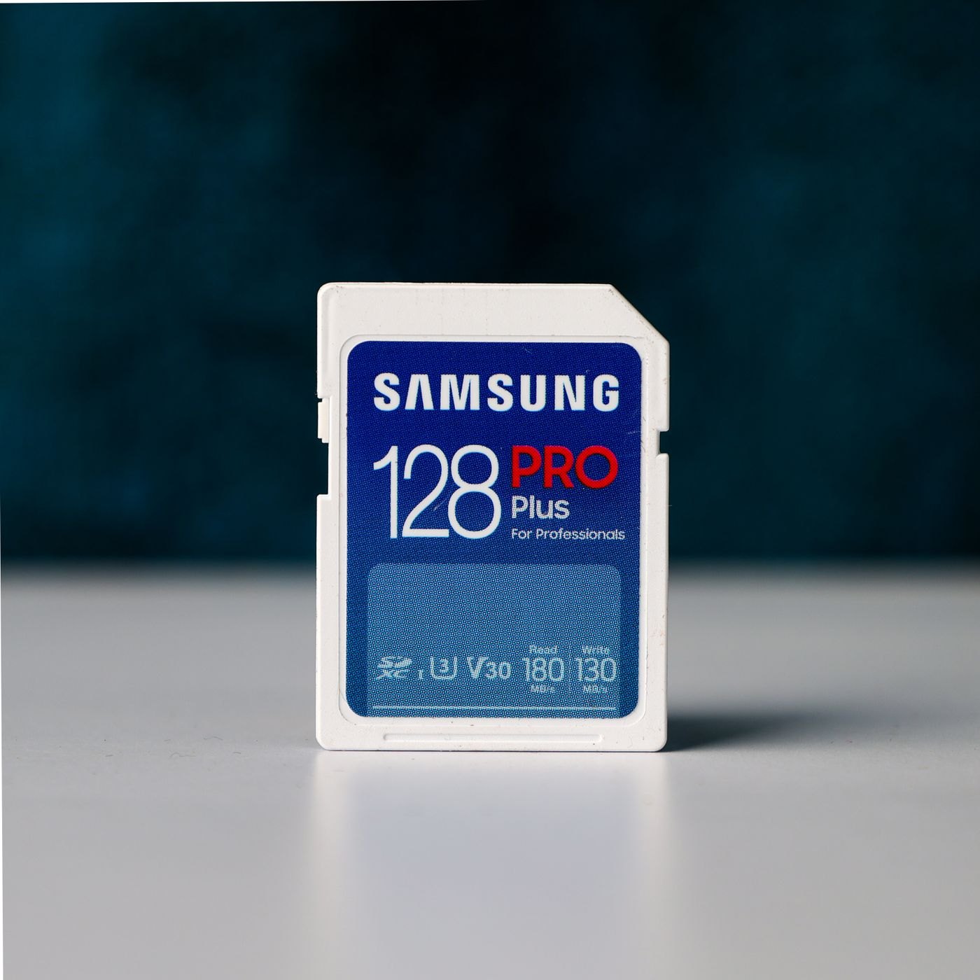 Camera memory card standing on a light surface