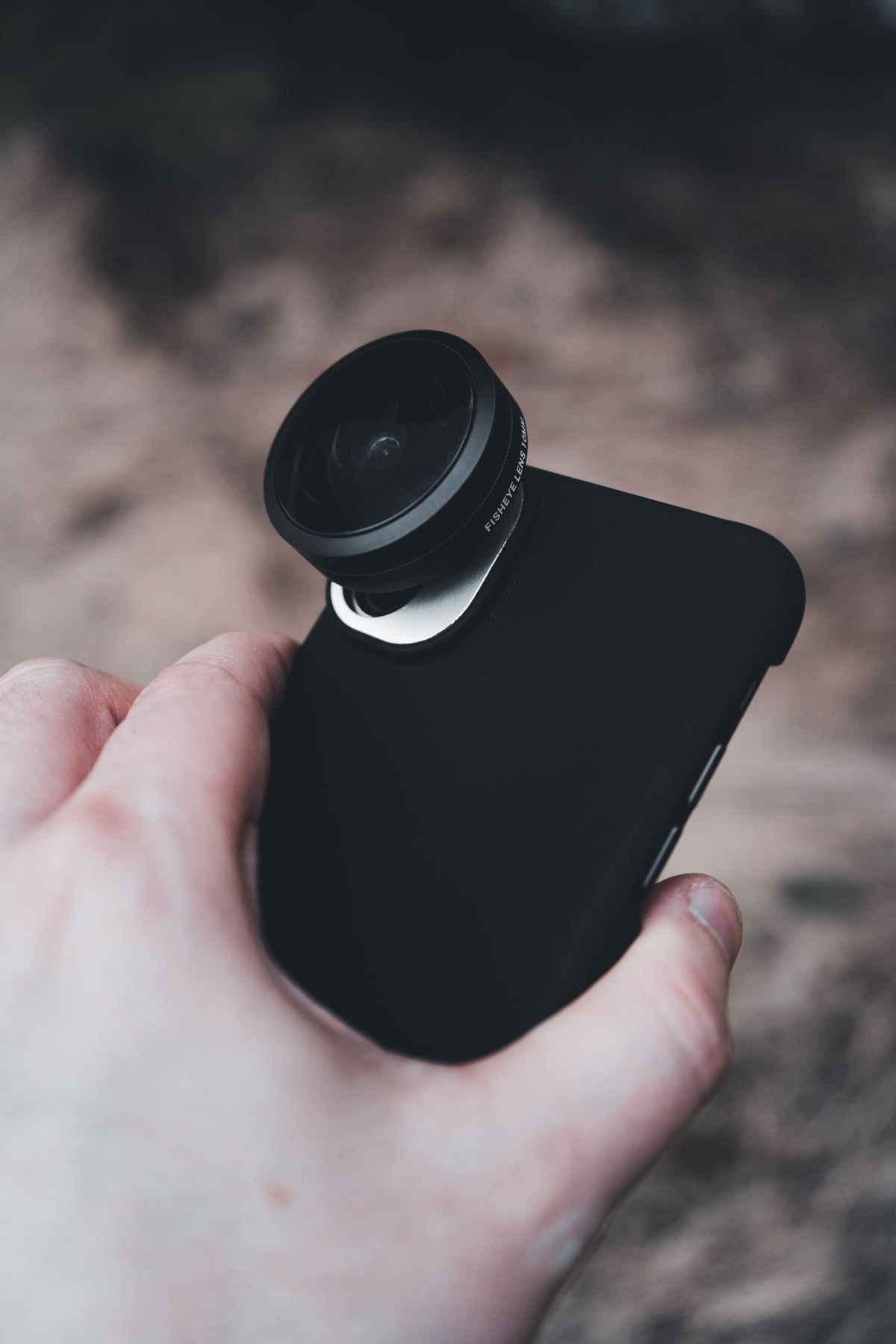Clip-on lens attached to a phone camera