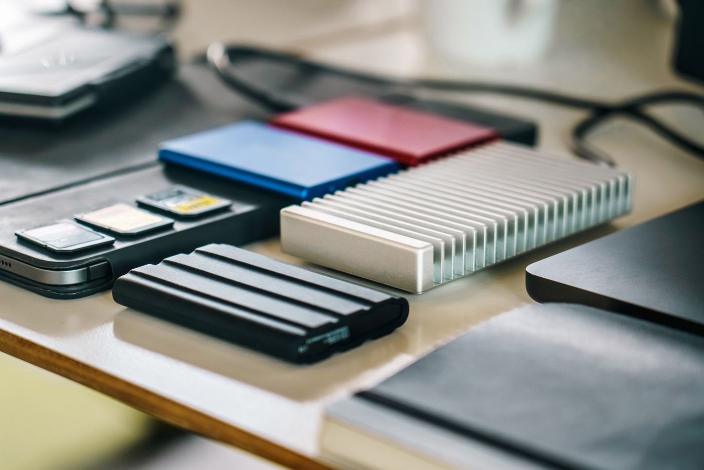Several portable storage devices arranged on a desk