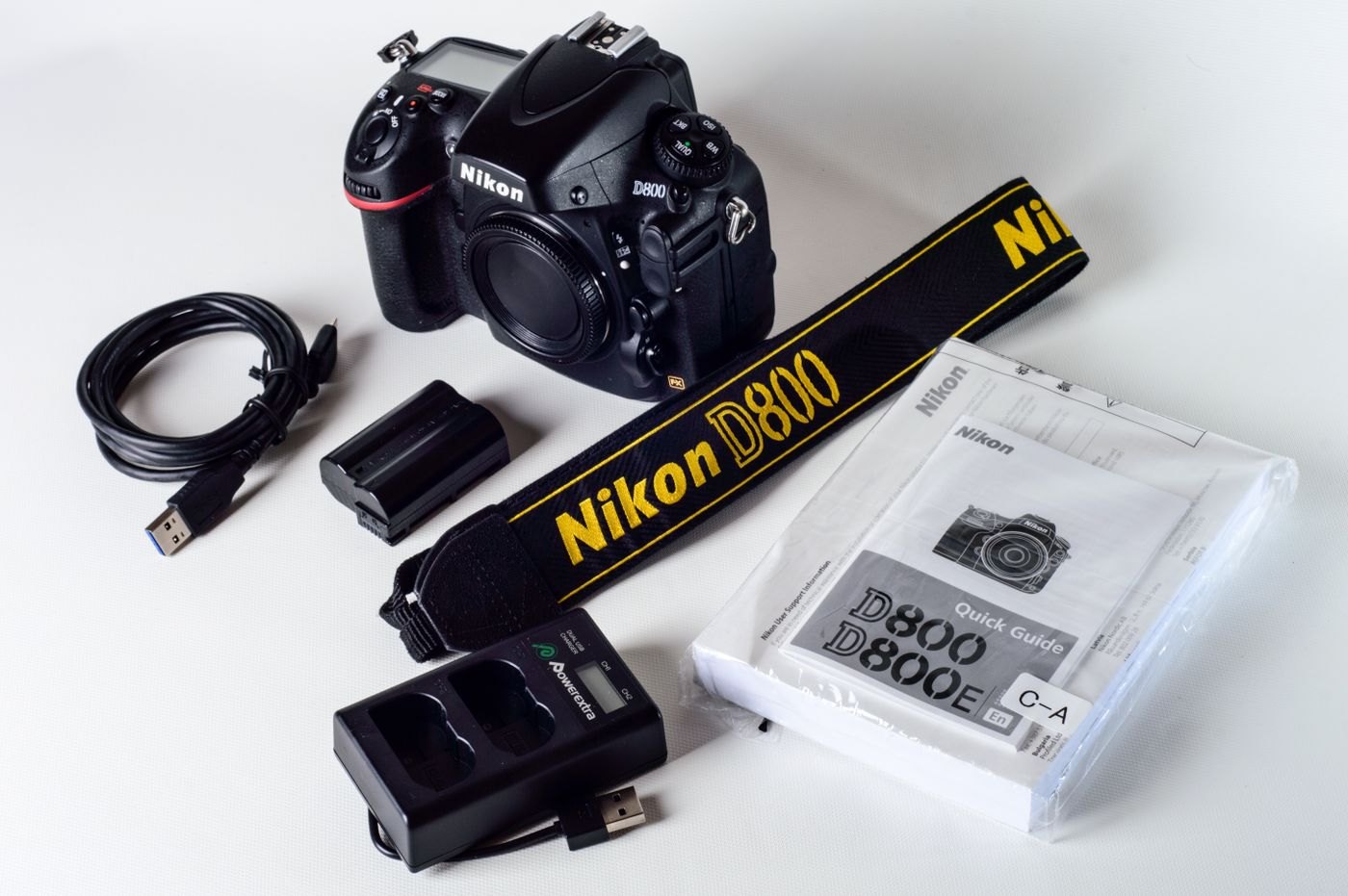 Camera battery charger and instruction booklet