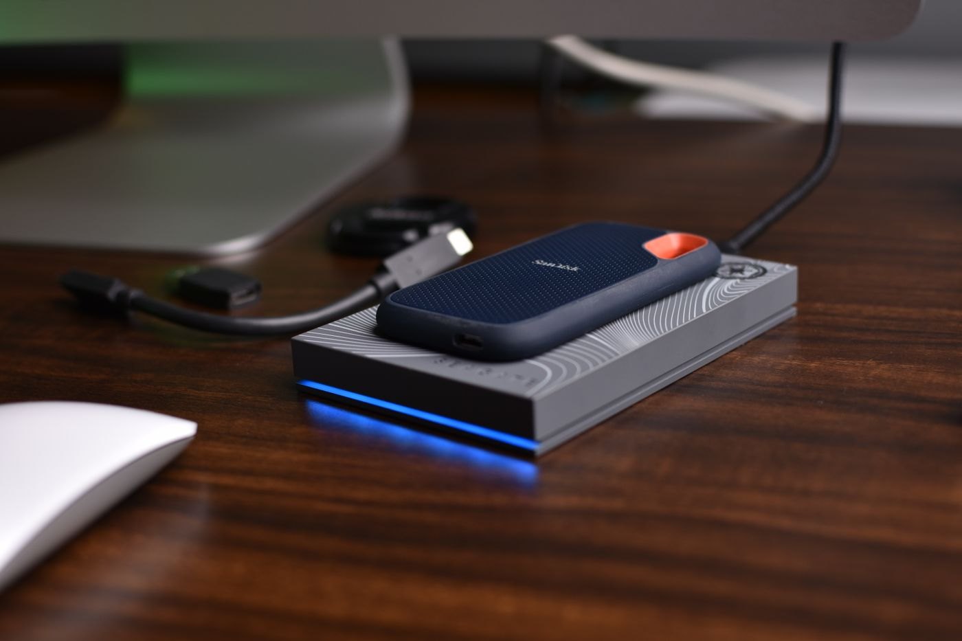 Portable drive and cable on a desk
