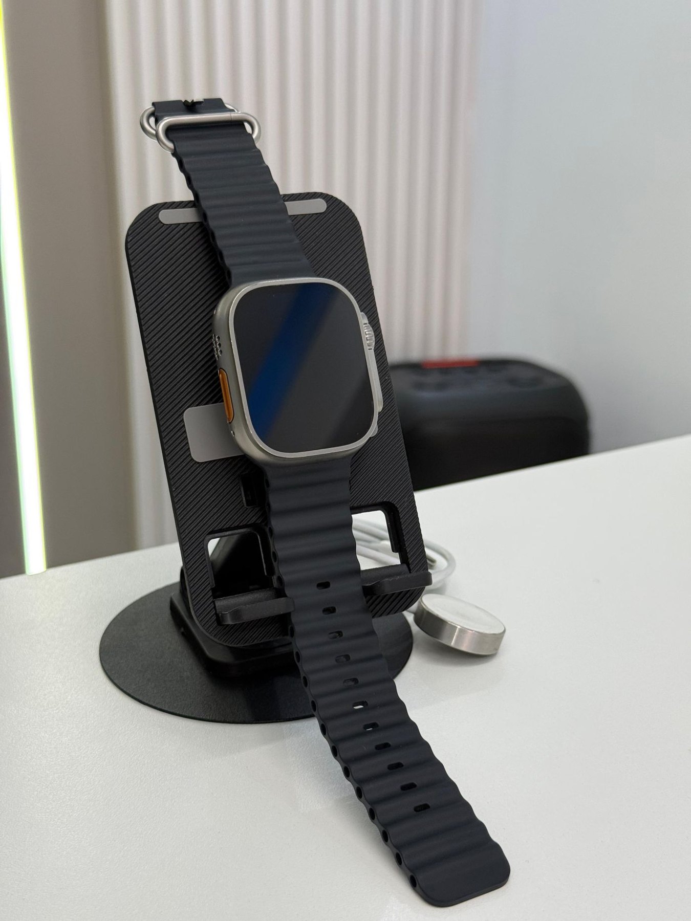 Smartwatch resting on a charging stand