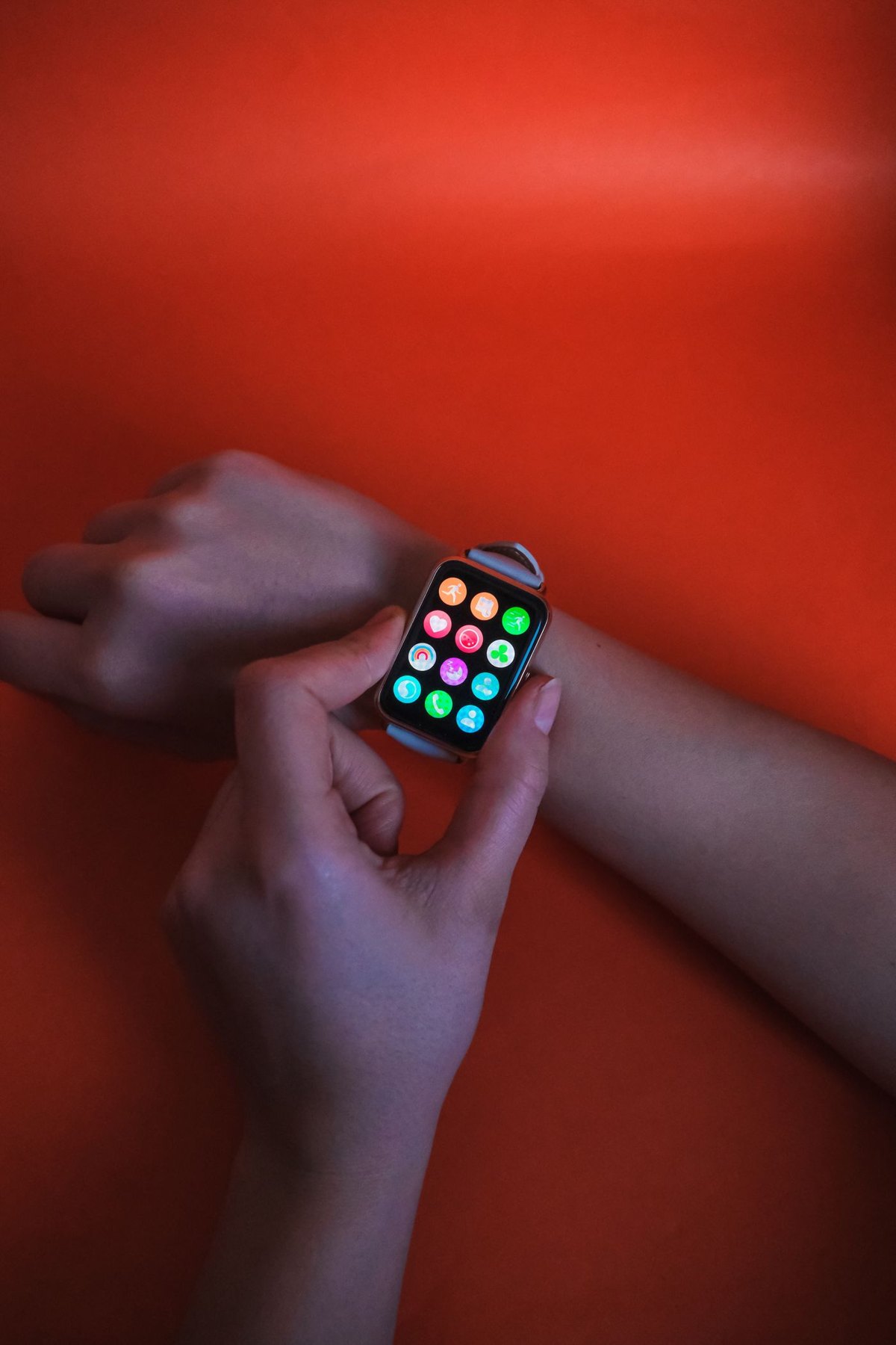 Smartwatch app icons on a wrist